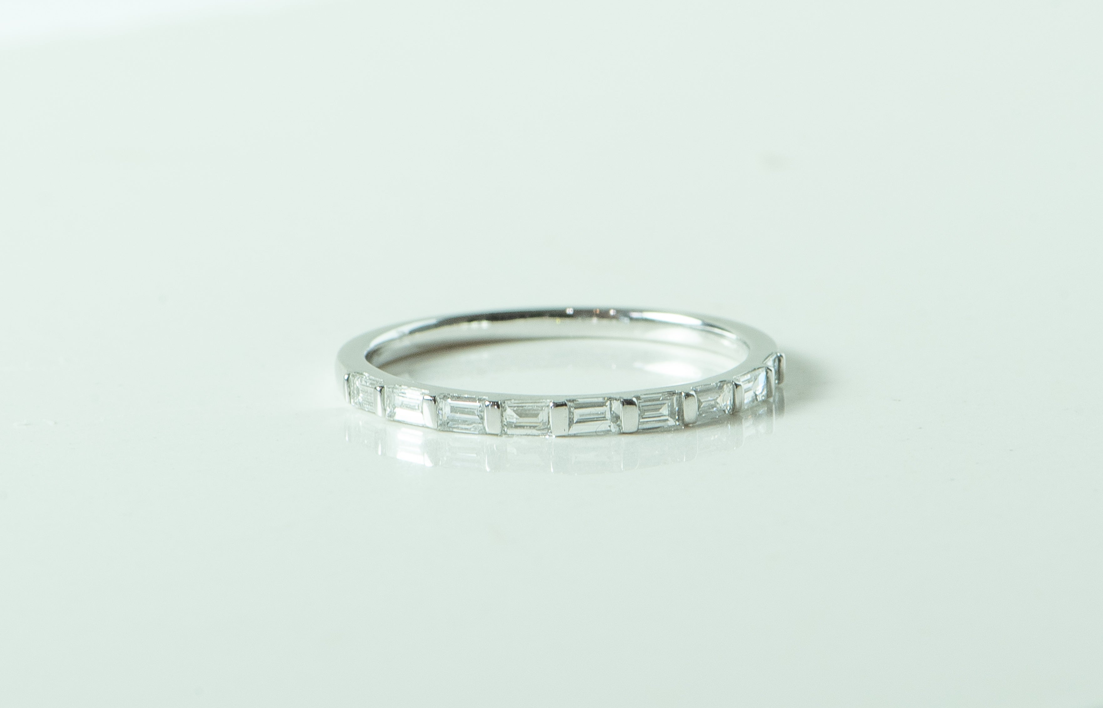 white gold and diamond ring. baguette diamonds. channel set. dainty ring. women's wedding band. every day ring. stacking ring. unique wedding band. yellow gold necklace. yellow gold diamond pendant. circle necklace. cable link chain. eternity necklace. SF jewelry, local jeweler, luxury, fine jewelry, bay area, handmade, gift for her, birthday gift, anniversary gift