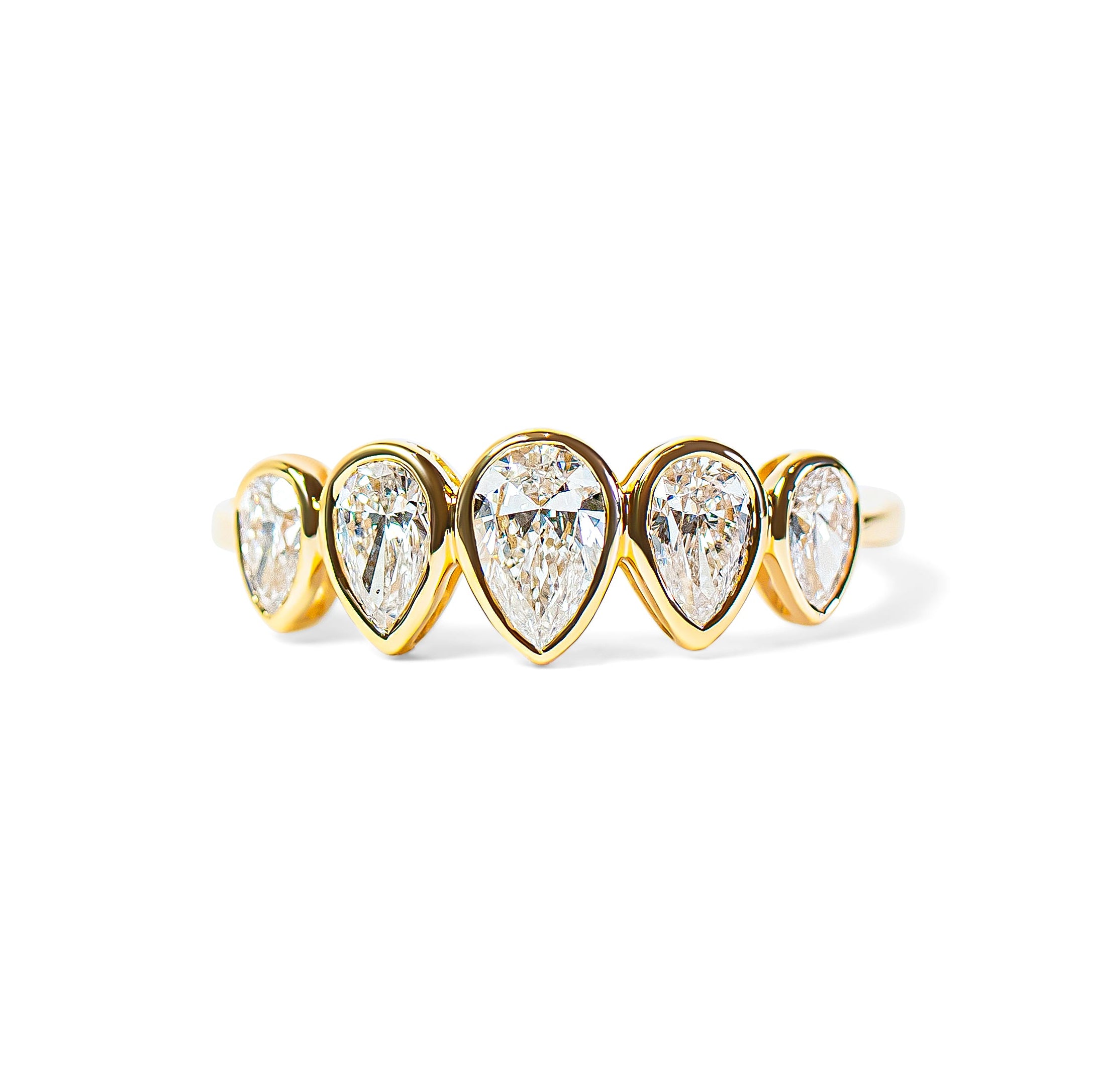 Gold ring with pear-shaped diamonds on a white background