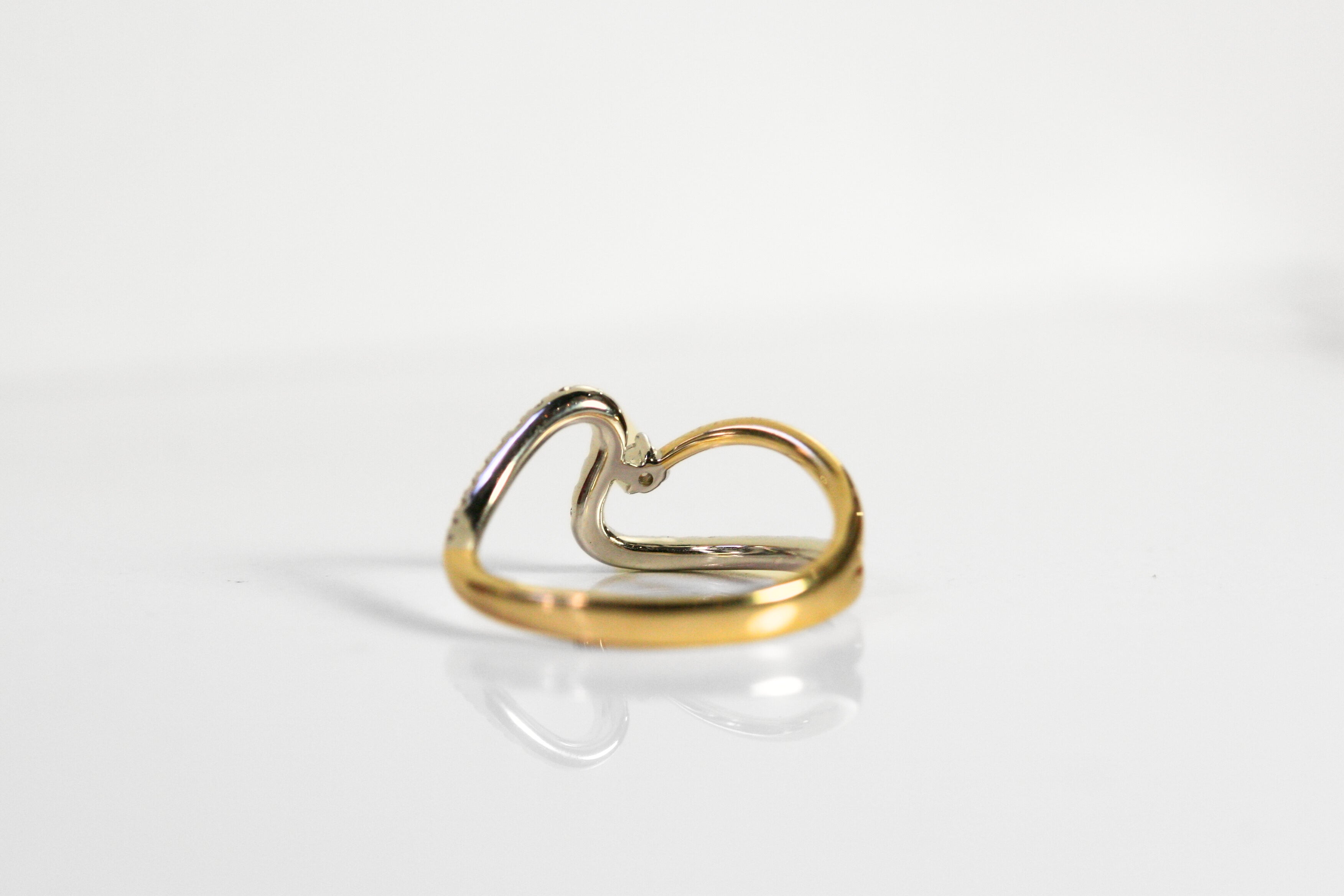 Back of the ring. Beyond the single diamond is an open hole to allow more light into the diamond and create more sparkle! Local SF jewelry, San francisco, Luxury, hand made, Bay area, gift for her.