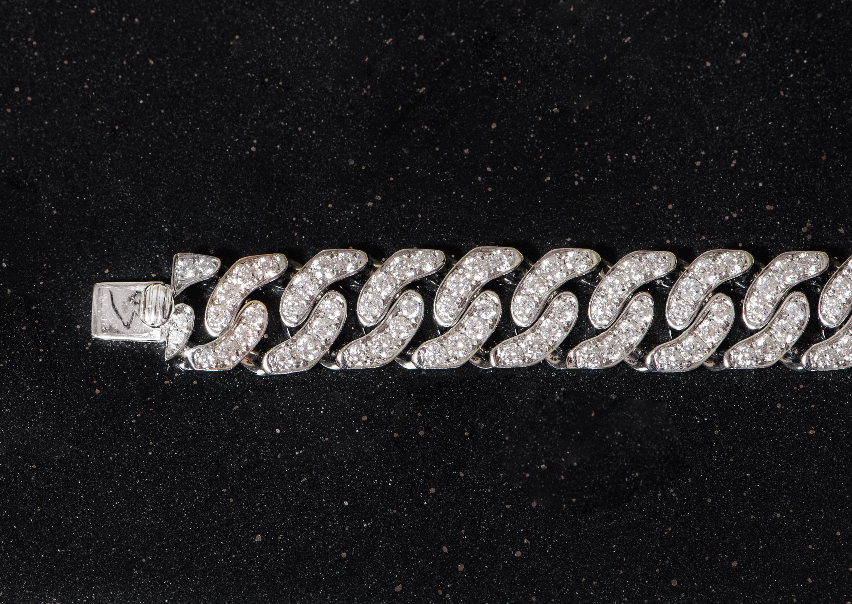 white gold and diamond cuban link bracelet.