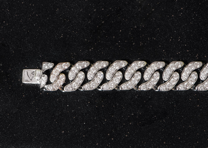 white gold and diamond cuban link bracelet.