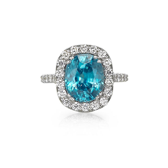 blue zircon ring. oval cut. blue gemstone turquoise gemstone. diamond halo. princess diana ring. diamond and white gold ring. colored gemstone. engagement ring. cocktail ring. statement ring. december birthstone. SF jewelry, local jeweler, luxury, fine jewelry, bay area, handmade, gift for her, birthday gift, anniversary gift