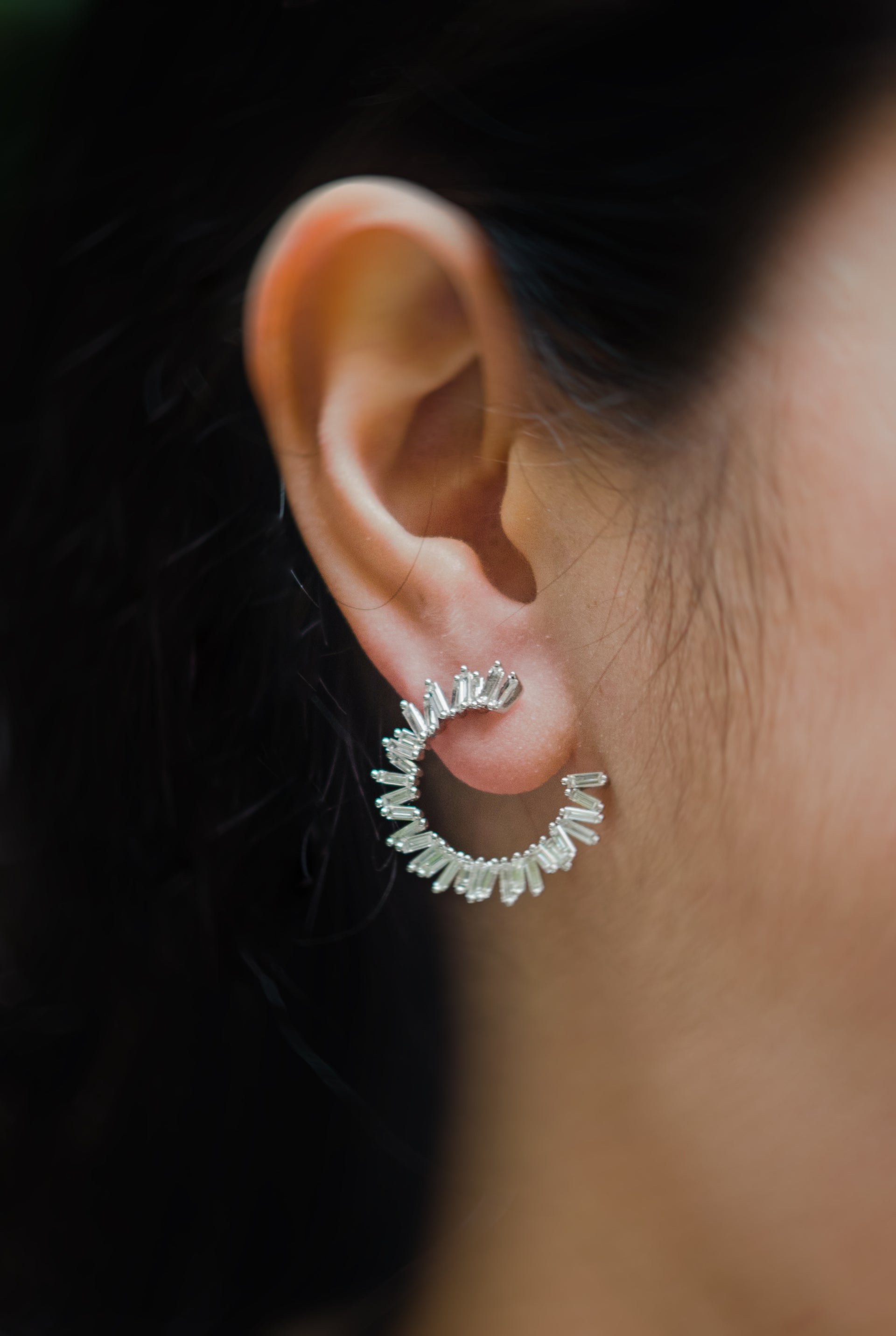 Long gold earrings. Two interlocking circles sit on the ear, while long gold chains dangle off the lower circle.  Local SF jewelry, San francisco, Luxury, hand made, Bay area, gift for her