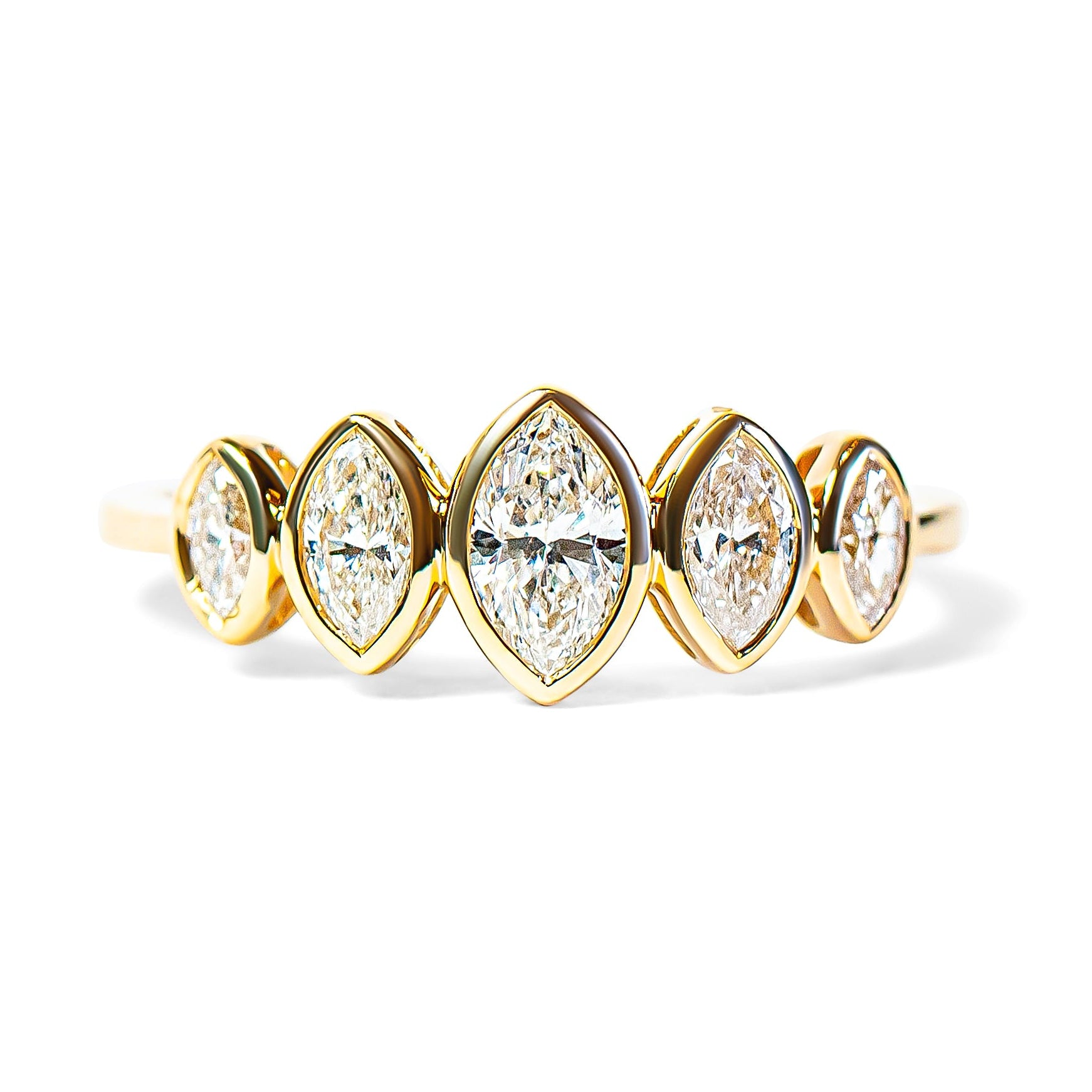 Gold ring with five marquise diamonds on a white background