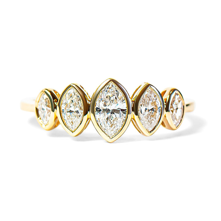Gold ring with five marquise diamonds on a white background