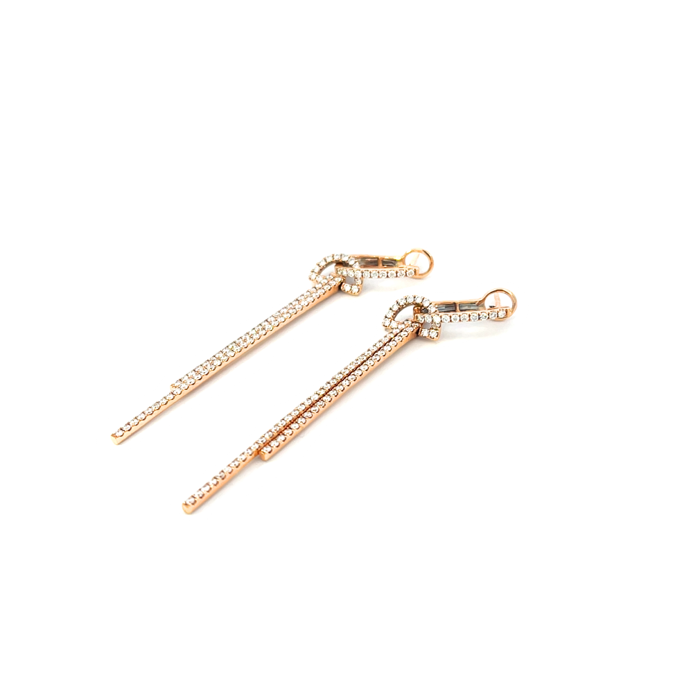 Rose gold earrings with diamonds on a white background
