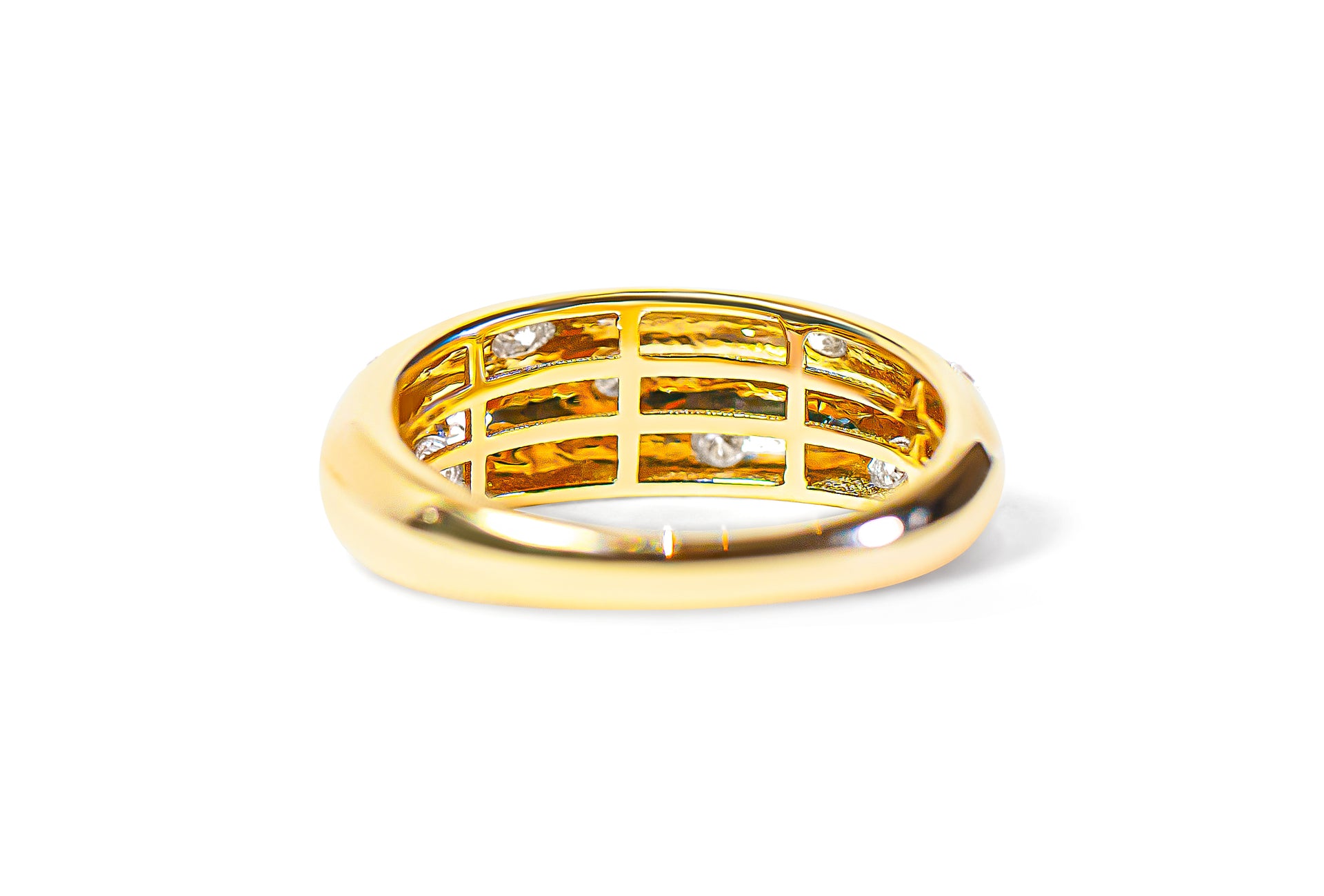 Back view of a gold ring with diamond accents on a white background