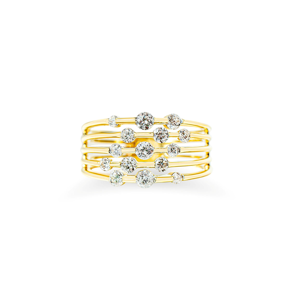 A gold multi-band ring featuring a central arrangement of scattered round brilliant cut diamonds, photographed against a solid white background.