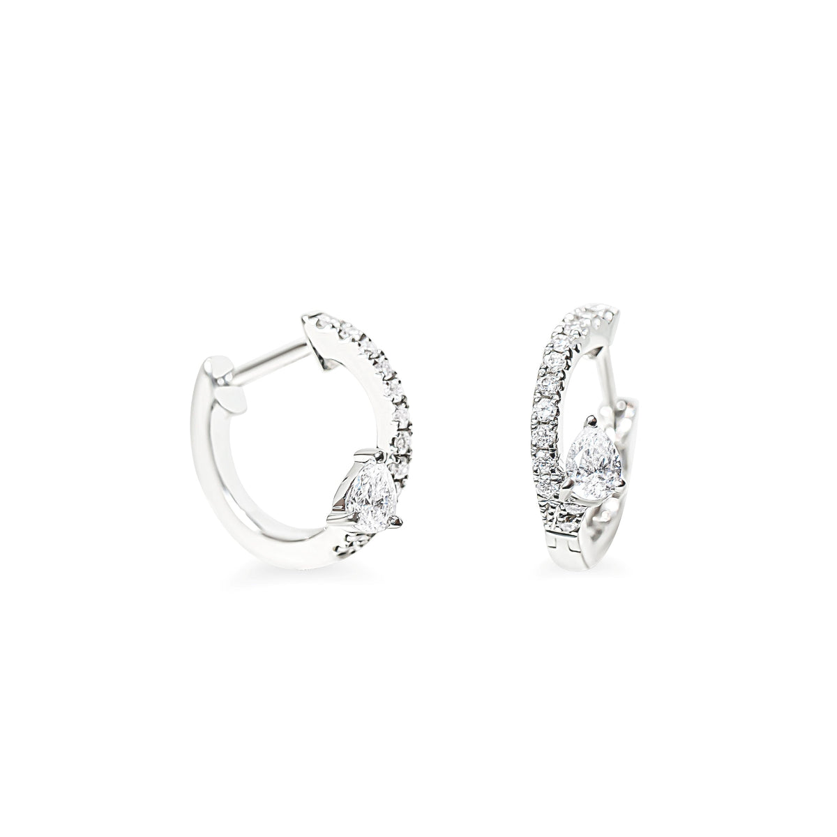 A pair of silver huggie hoop earrings with pear-cut clear diamonds and pave round diamonds, shown on a clean white background.