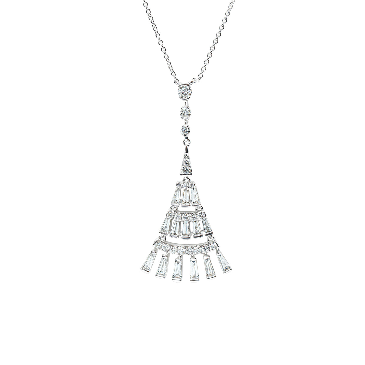 A silver-toned necklace featuring a tiered, fan-shaped pendant set with white baguette and round diamonds, suspended from a delicate chain against a plain white background.