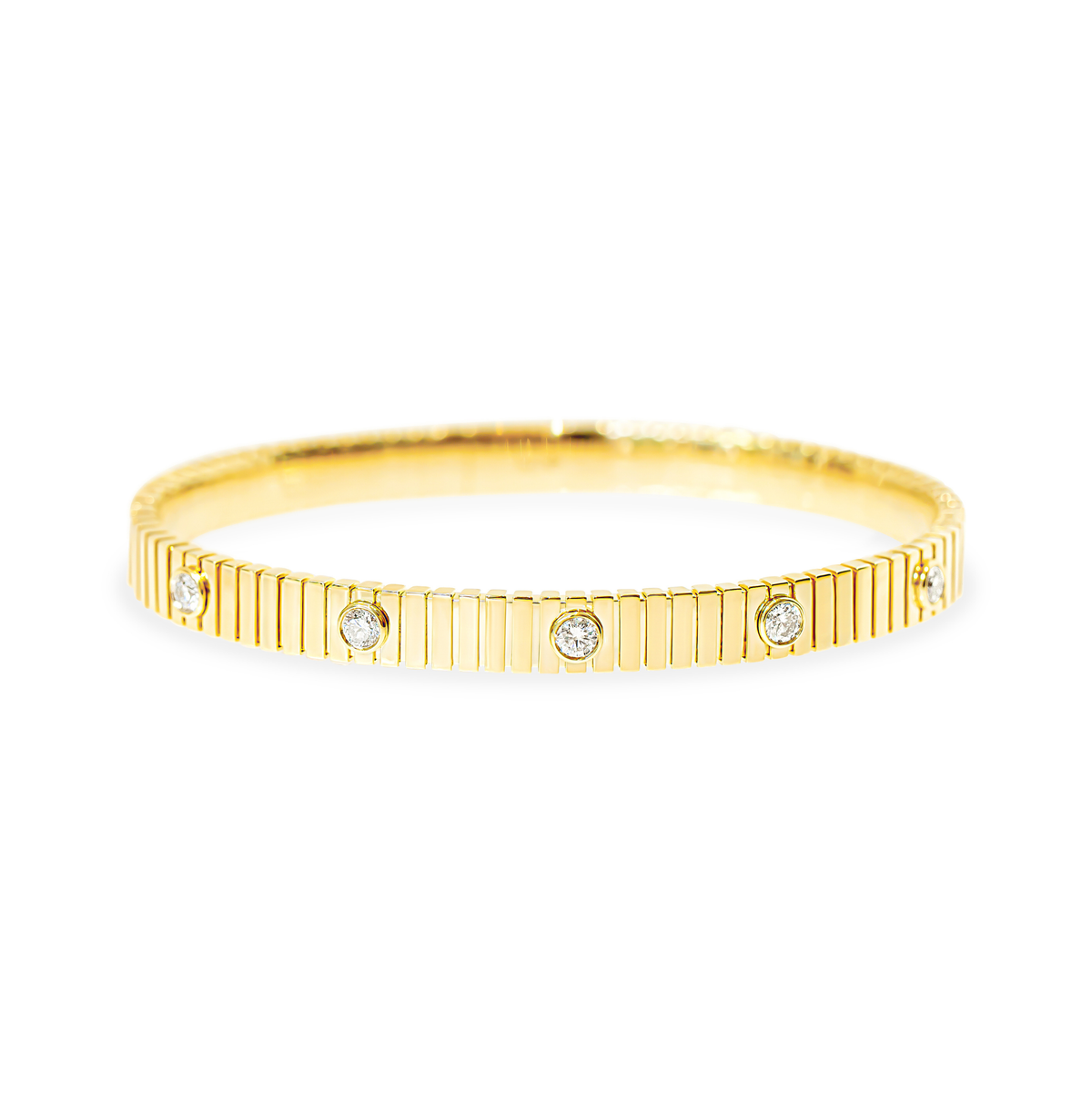 A yellow gold bangle bracelet featuring a textured, fluted outer band and five evenly spaced bezel round diamonds, shown on a plain white background.