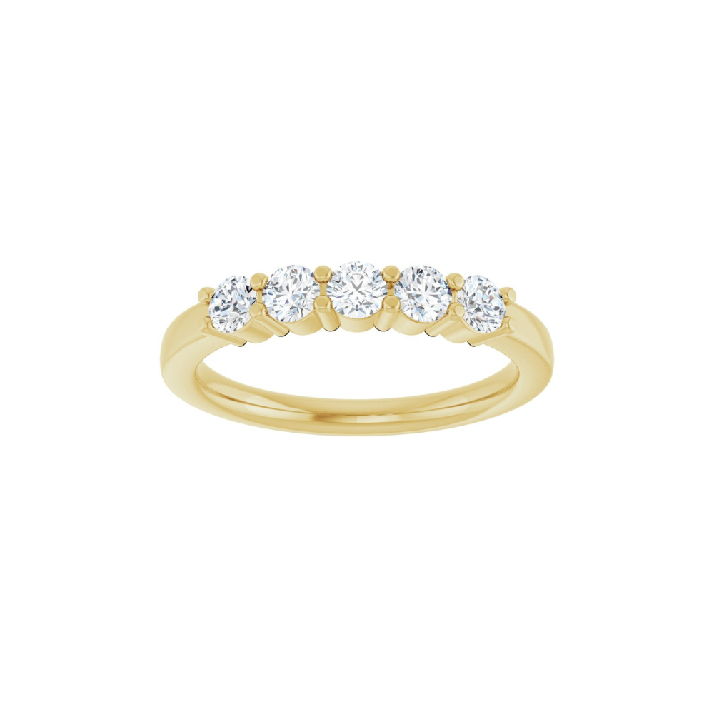 Gold ring with five diamonds on a white background