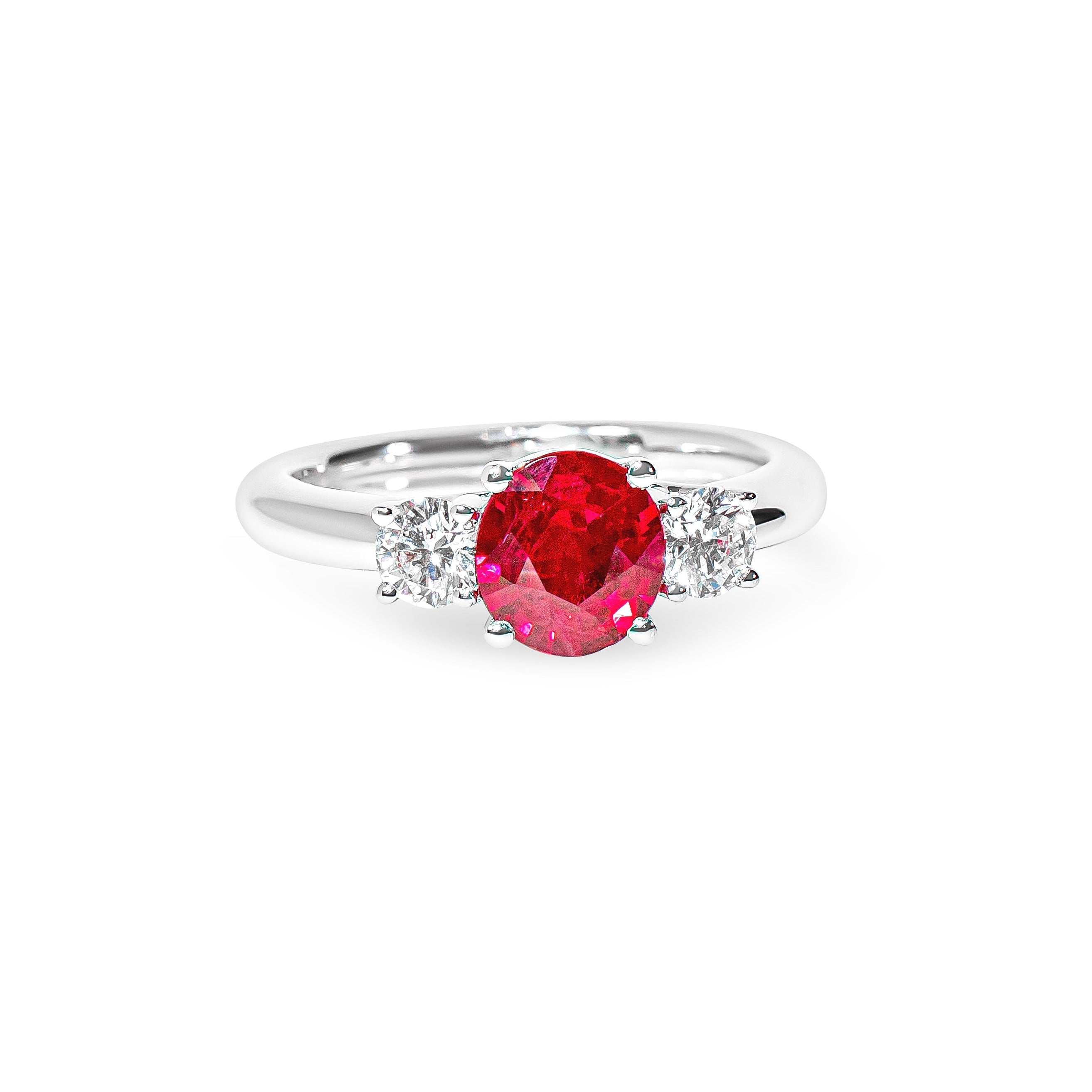 Platinum ring with a red ruby and diamonds on a white background