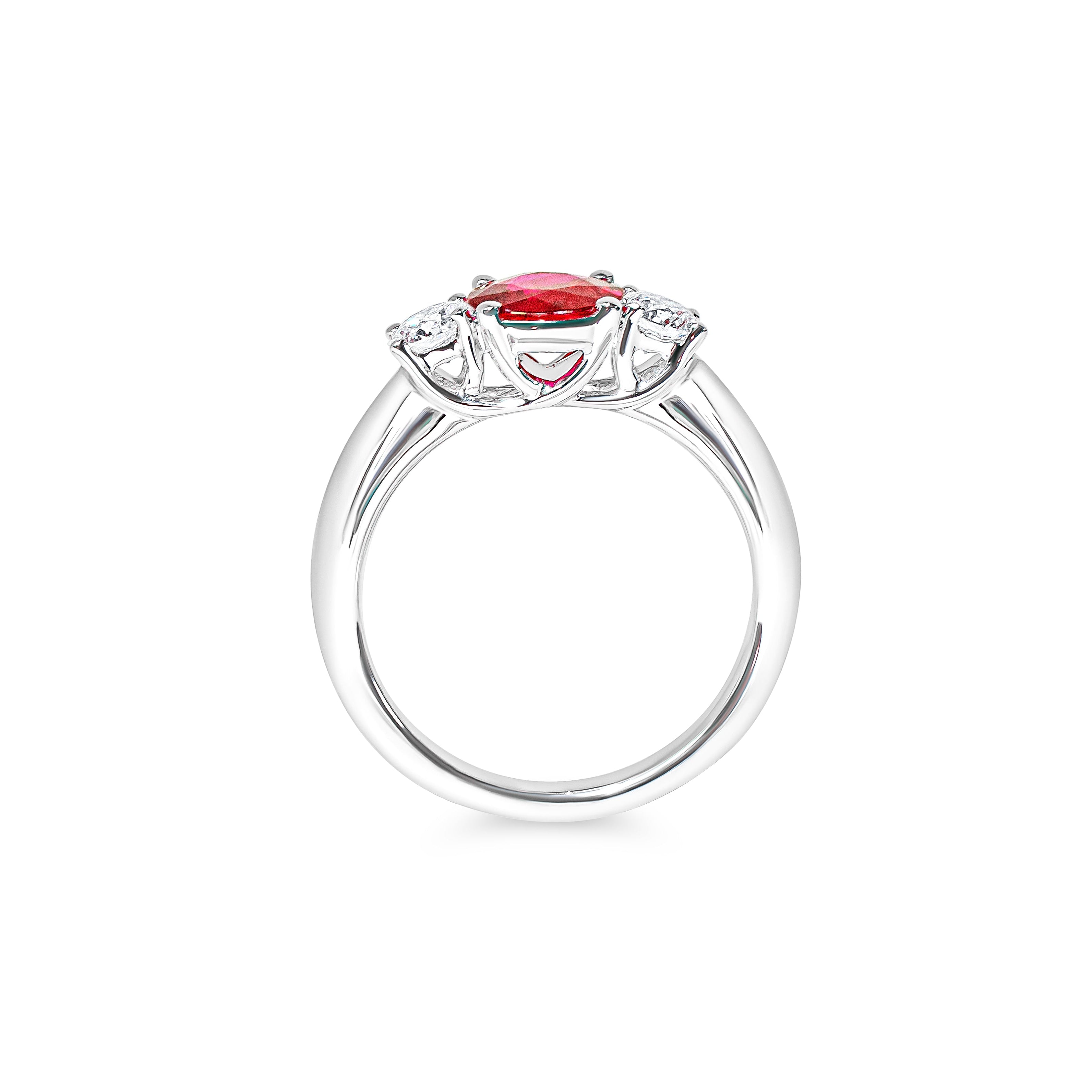 Platinum ring with a red ruby and diamonds on a white background