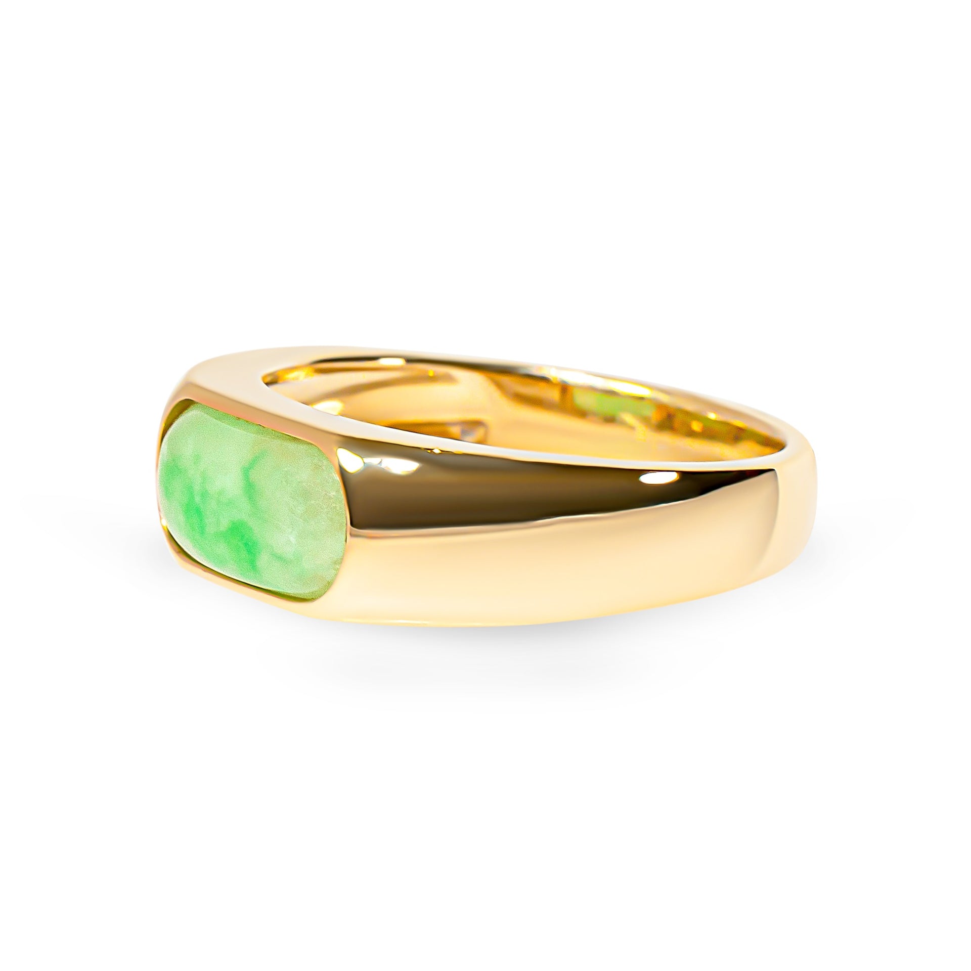Gold ring with a green jade on a white background
