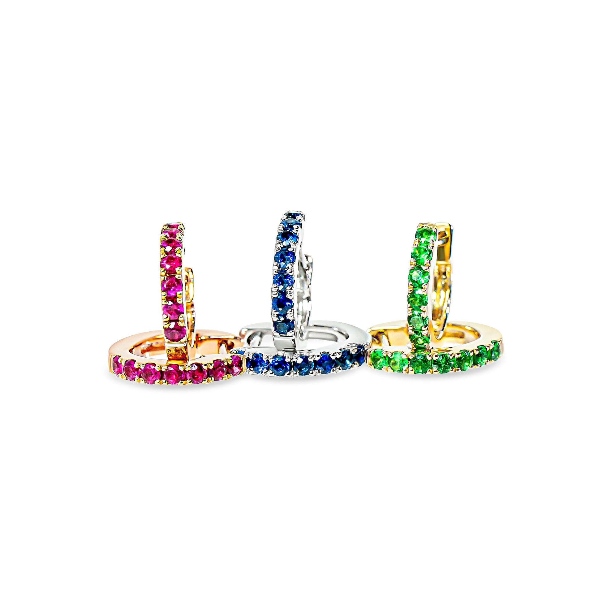 Three colorful hoop earrings on a white background