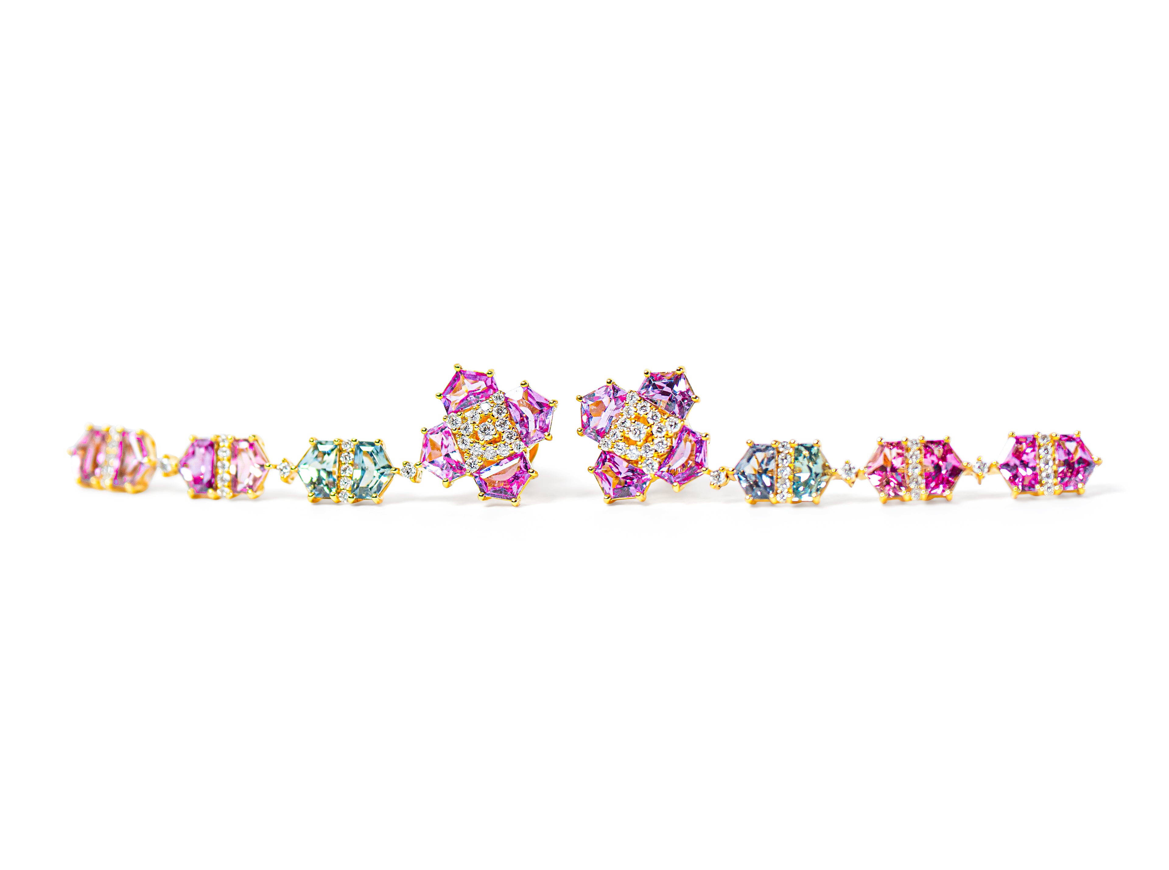 Multicolored sapphire drop earrings with a floral design on a white background