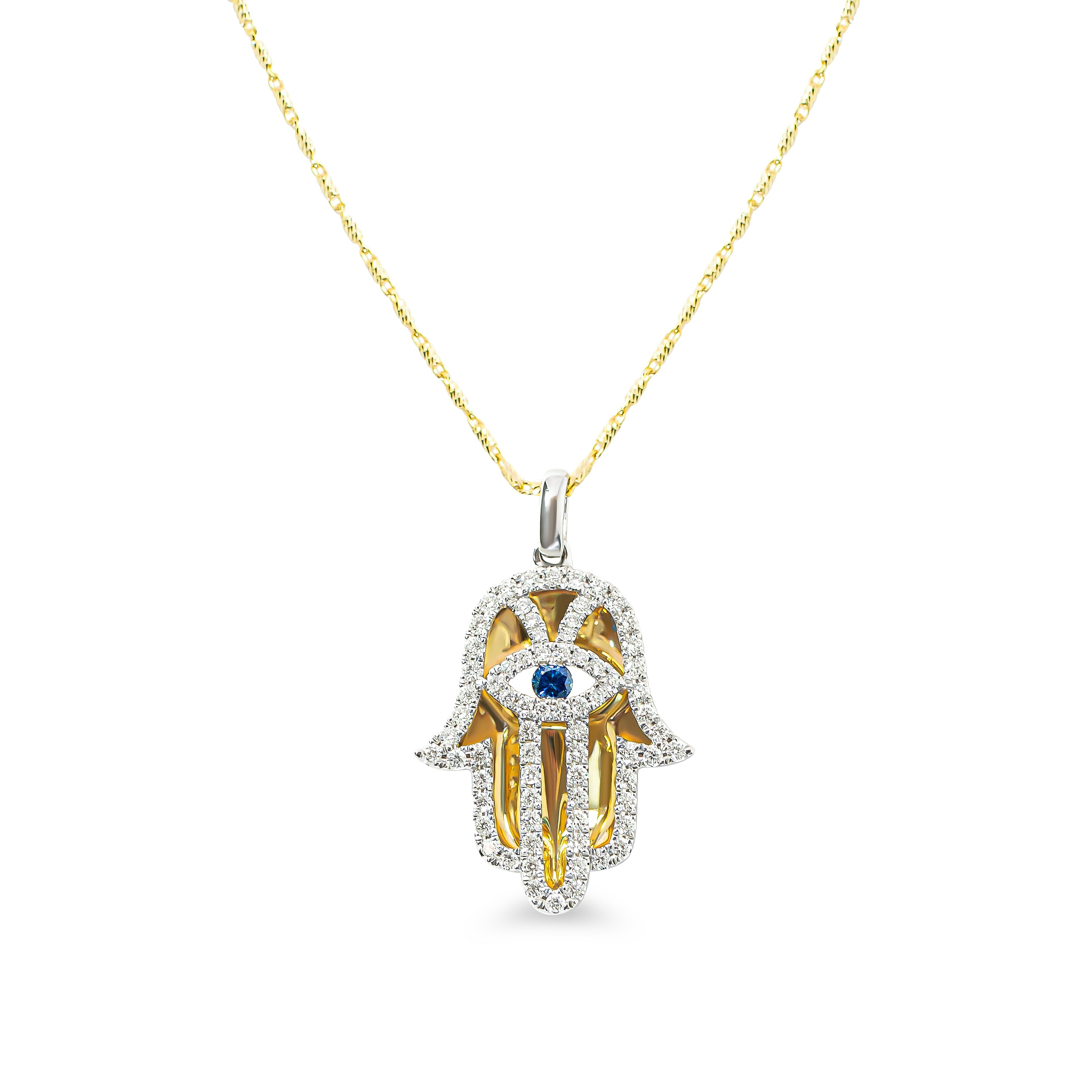 yellow and white gold Hamsa hand pendant with blue sapphire and diamonds on a white background 