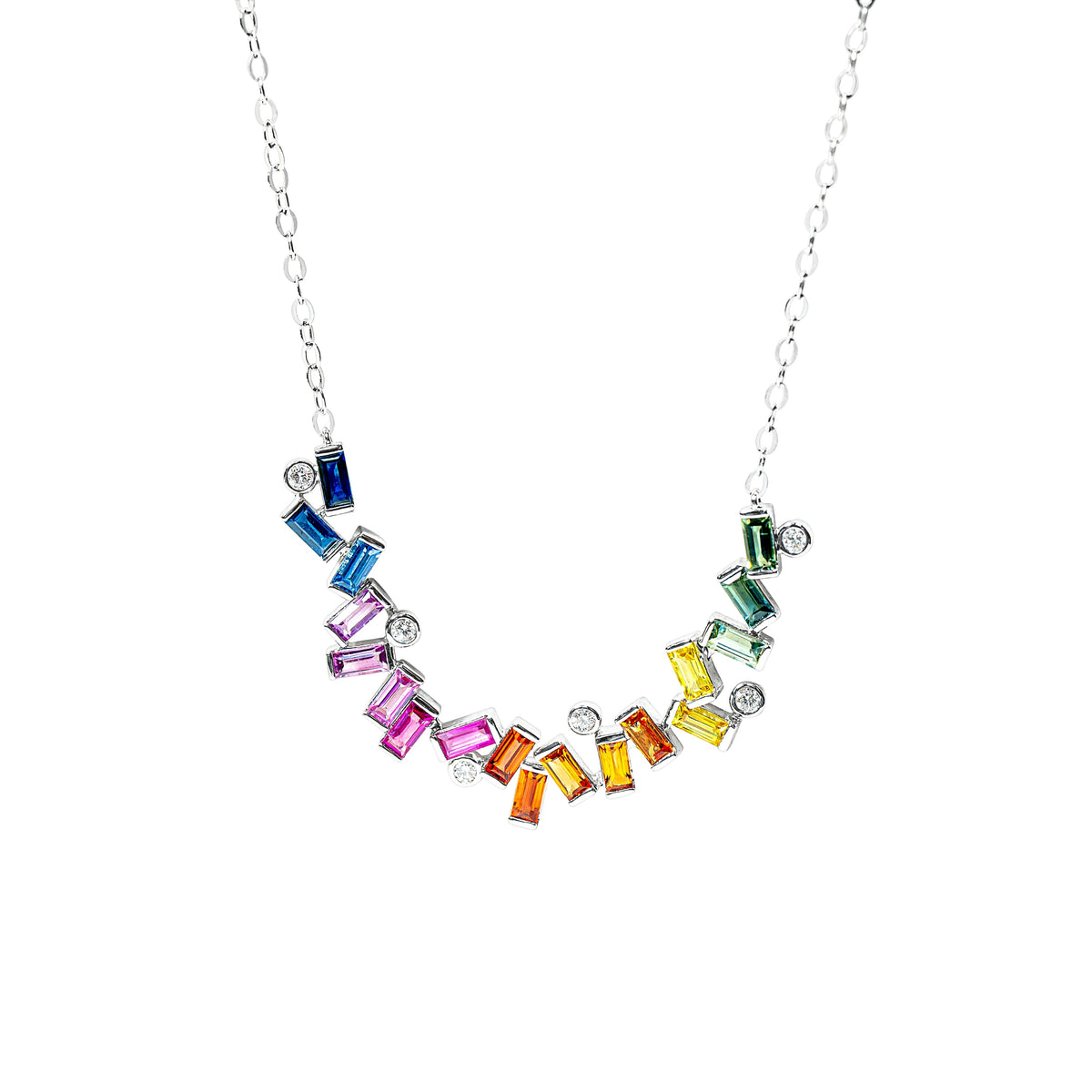 A silver chain necklace featuring a curved row of colorful baguette sapphires in blue, pink, orange, yellow, green, and purple, accented with round diamonds, shown on a plain white background.