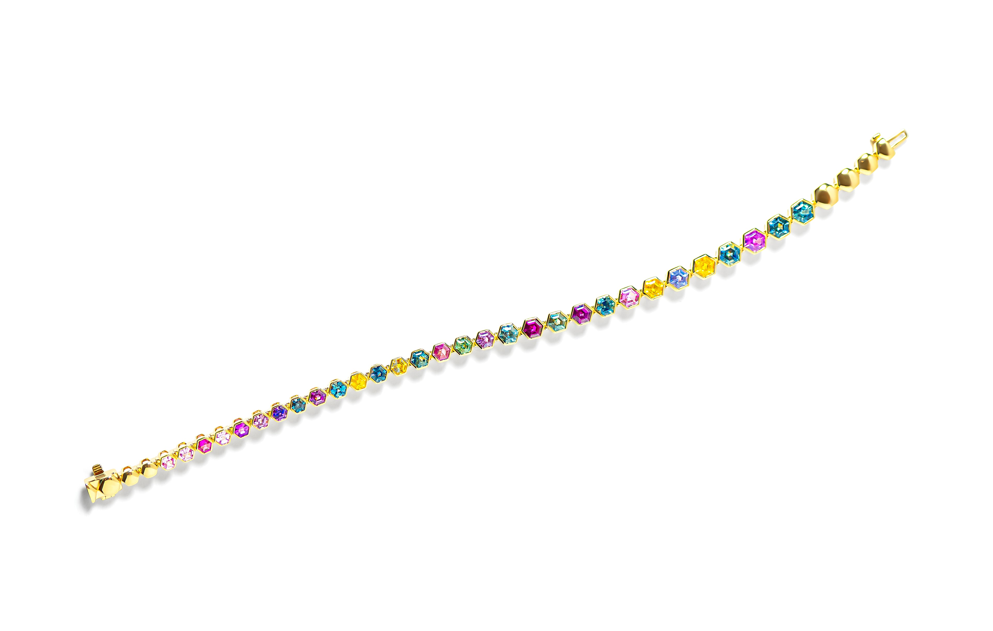 Multicolored sapphire gold bracelet on a white background