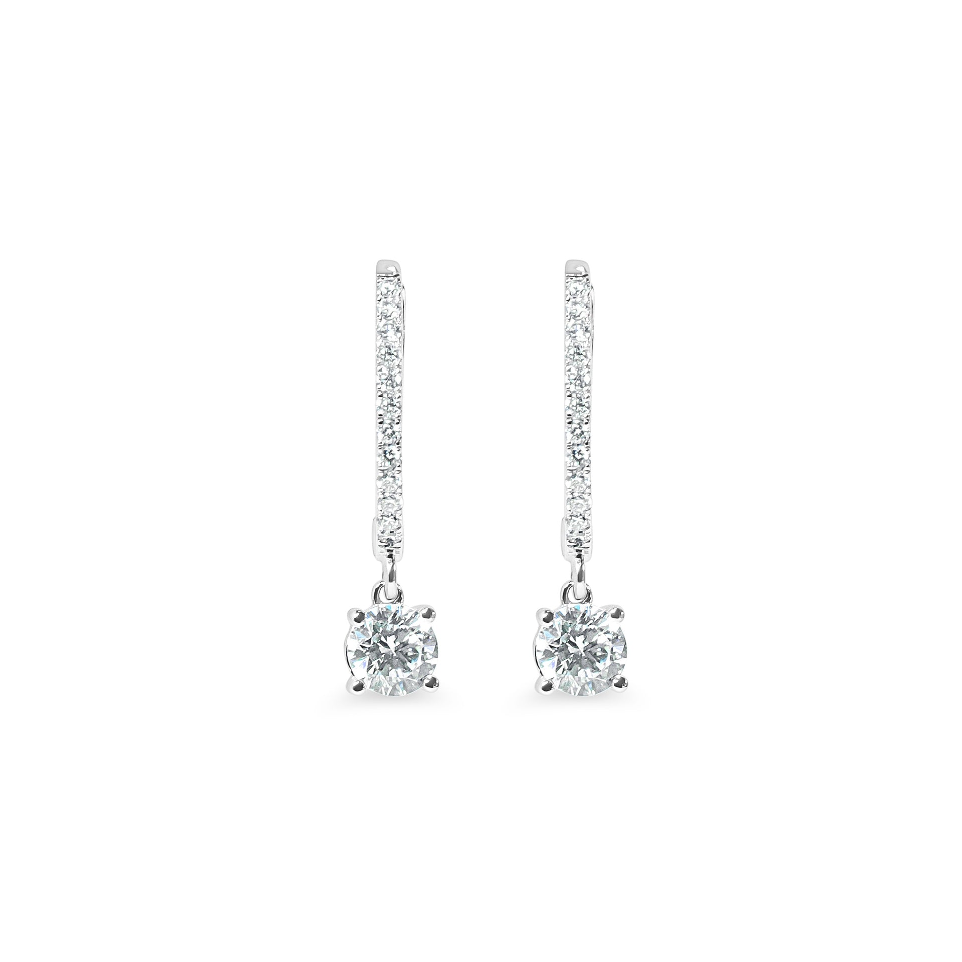 Pair of diamond huggie earrings on a white background