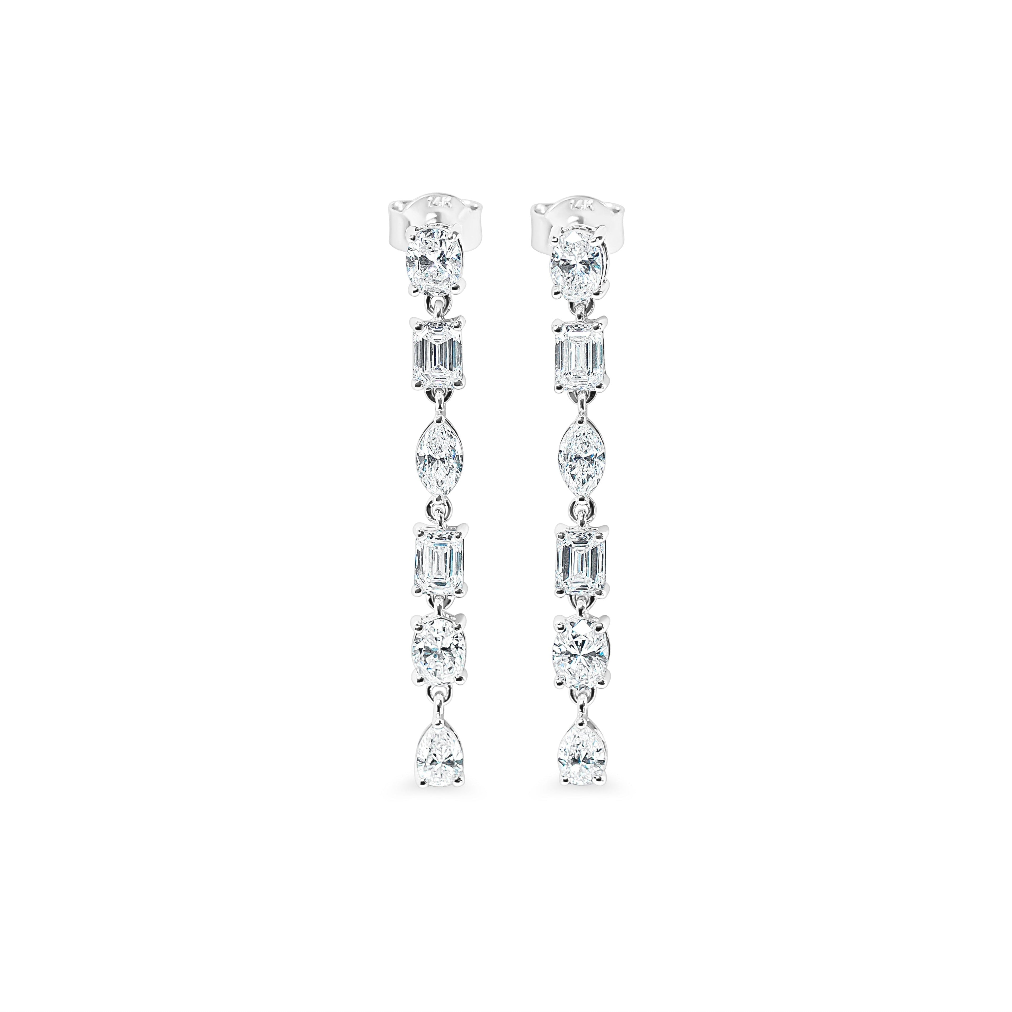 Pair of diamond drop earrings on a white background