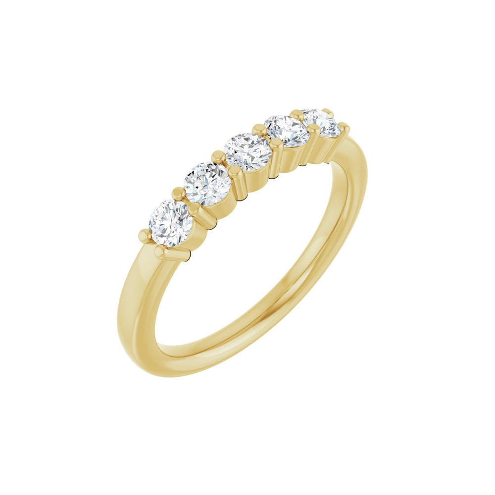 Gold ring with five diamonds on a white background