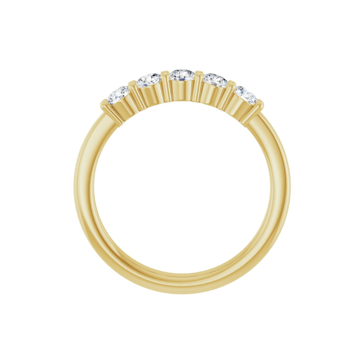 Gold ring with five diamonds on a white background