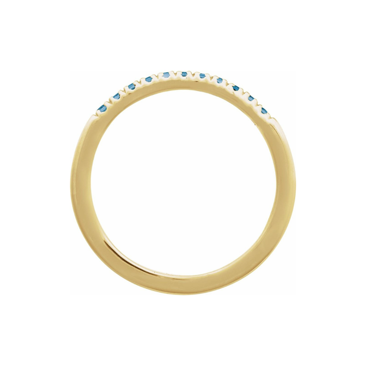 Gold ring with blue london topaz stones on a white background