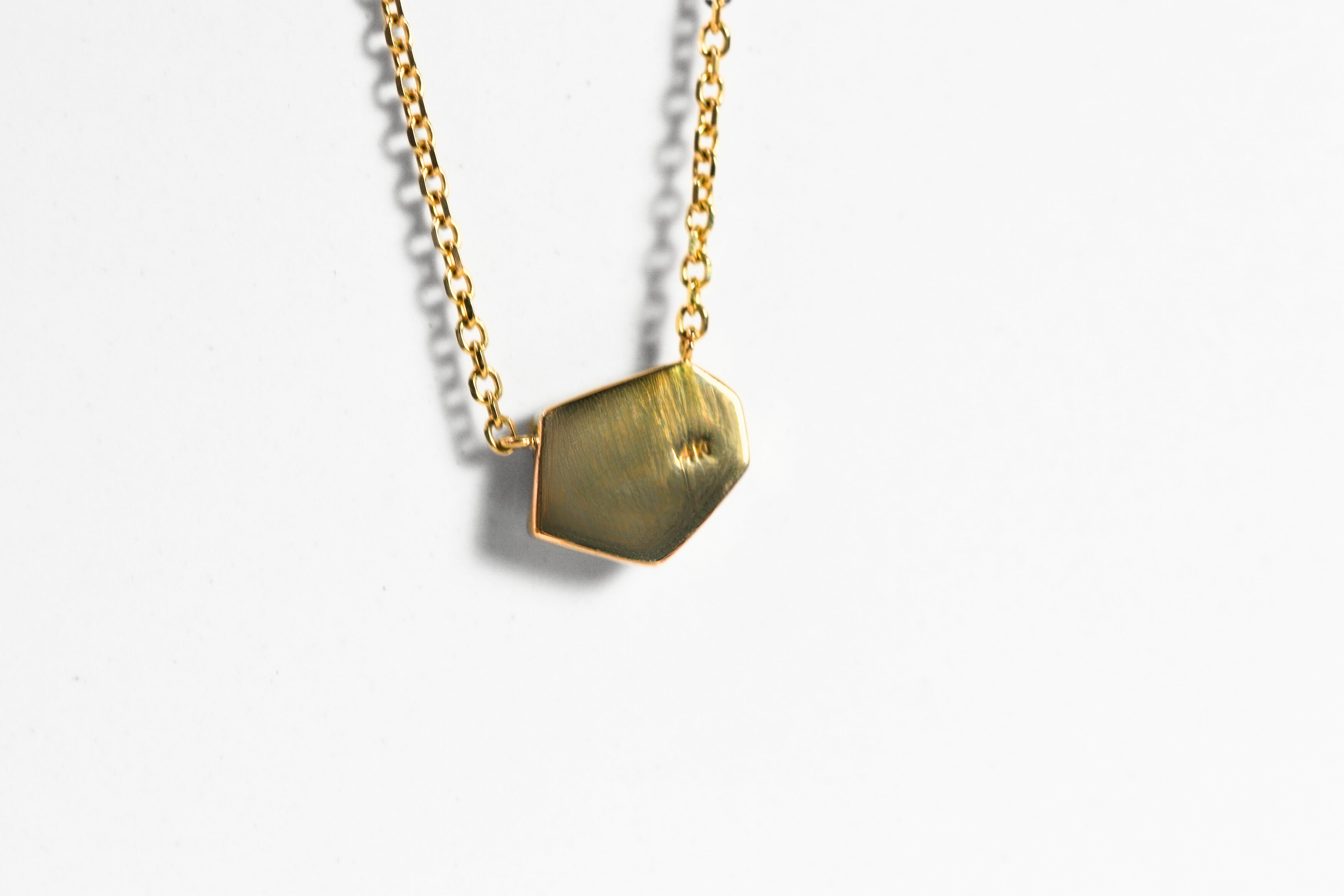 The back of the pendant is a solid cover of 14k yellow gold. This could be engraved!