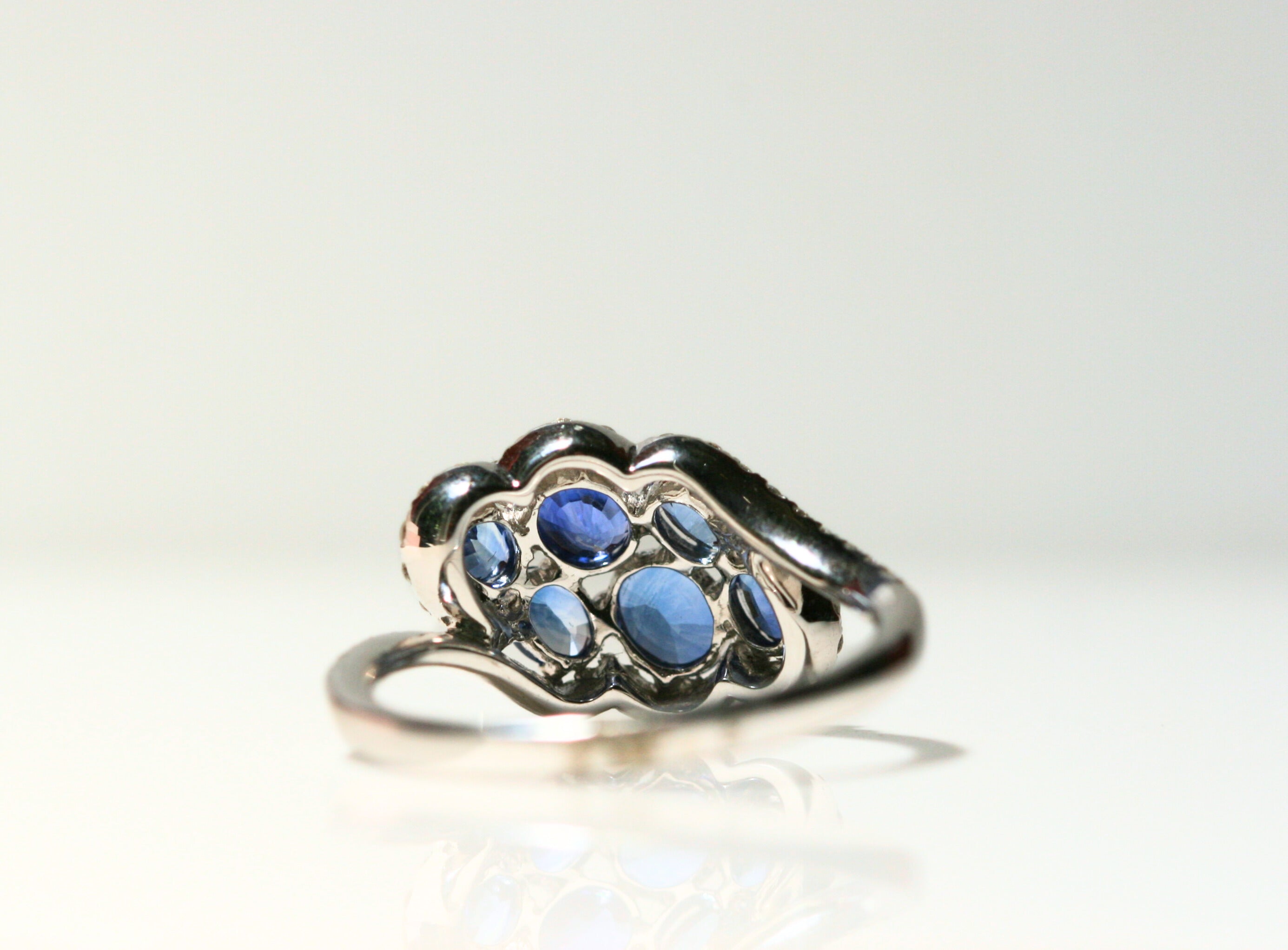 The back of the ring. Behind each sapphire is an open space, to allow maximum light in and create maximum sparkle!