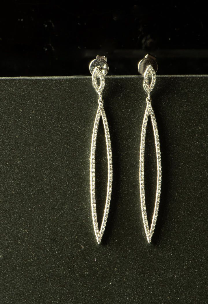 White gold dangle earrings. Diamonds are pave set. Marquise shape - ovals with pointy ends. Have post backings.