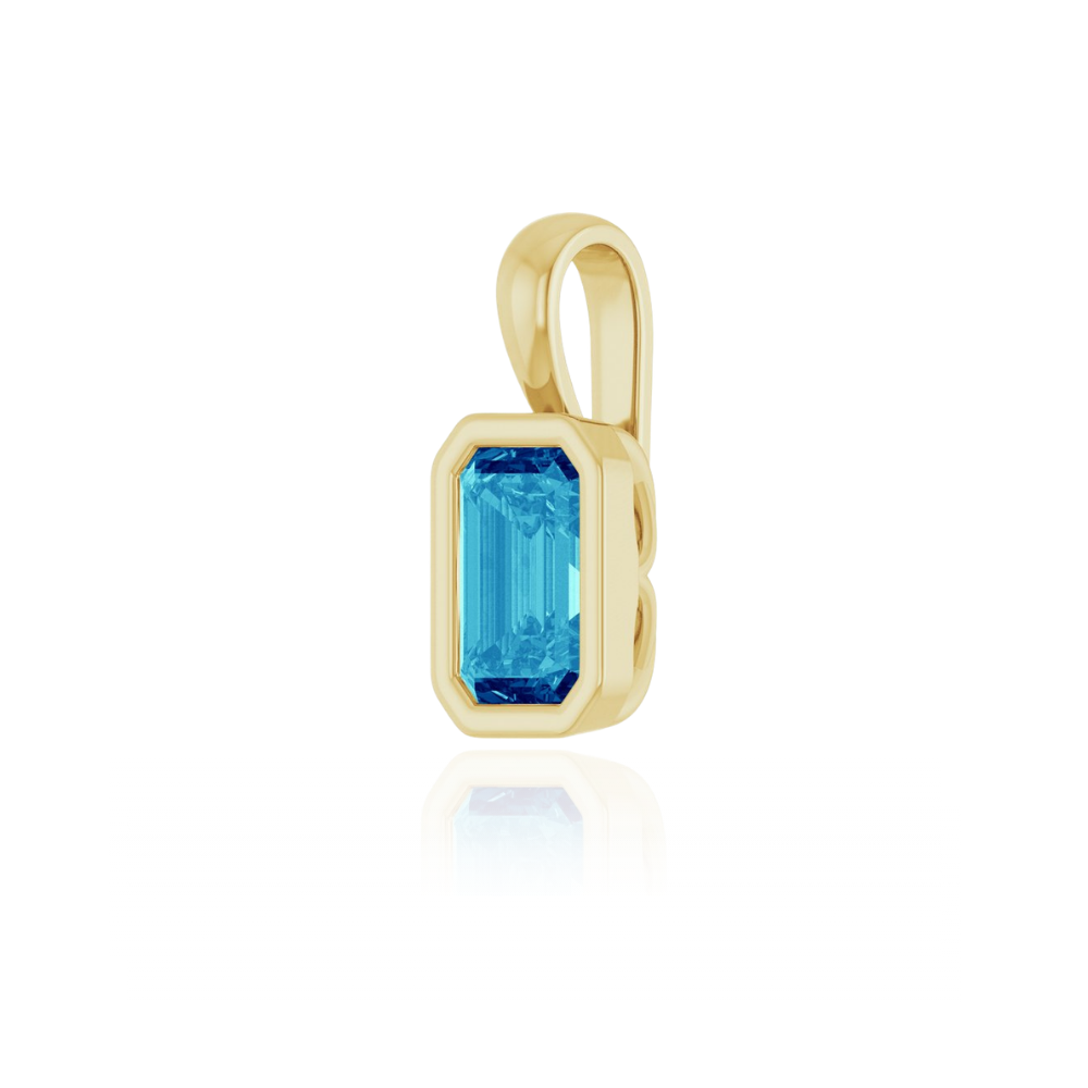 Gold pendant with a blue gemstone on a white background