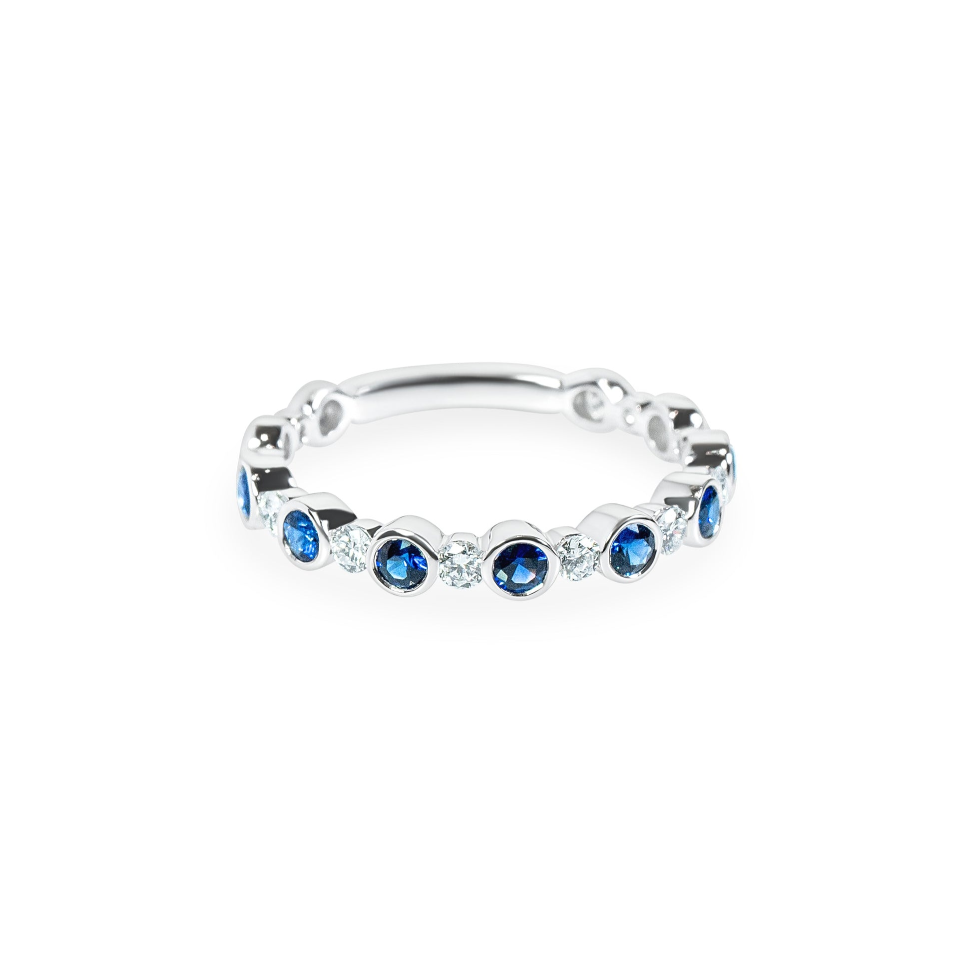 White gold ring with blue sapphires and diamonds on a white background