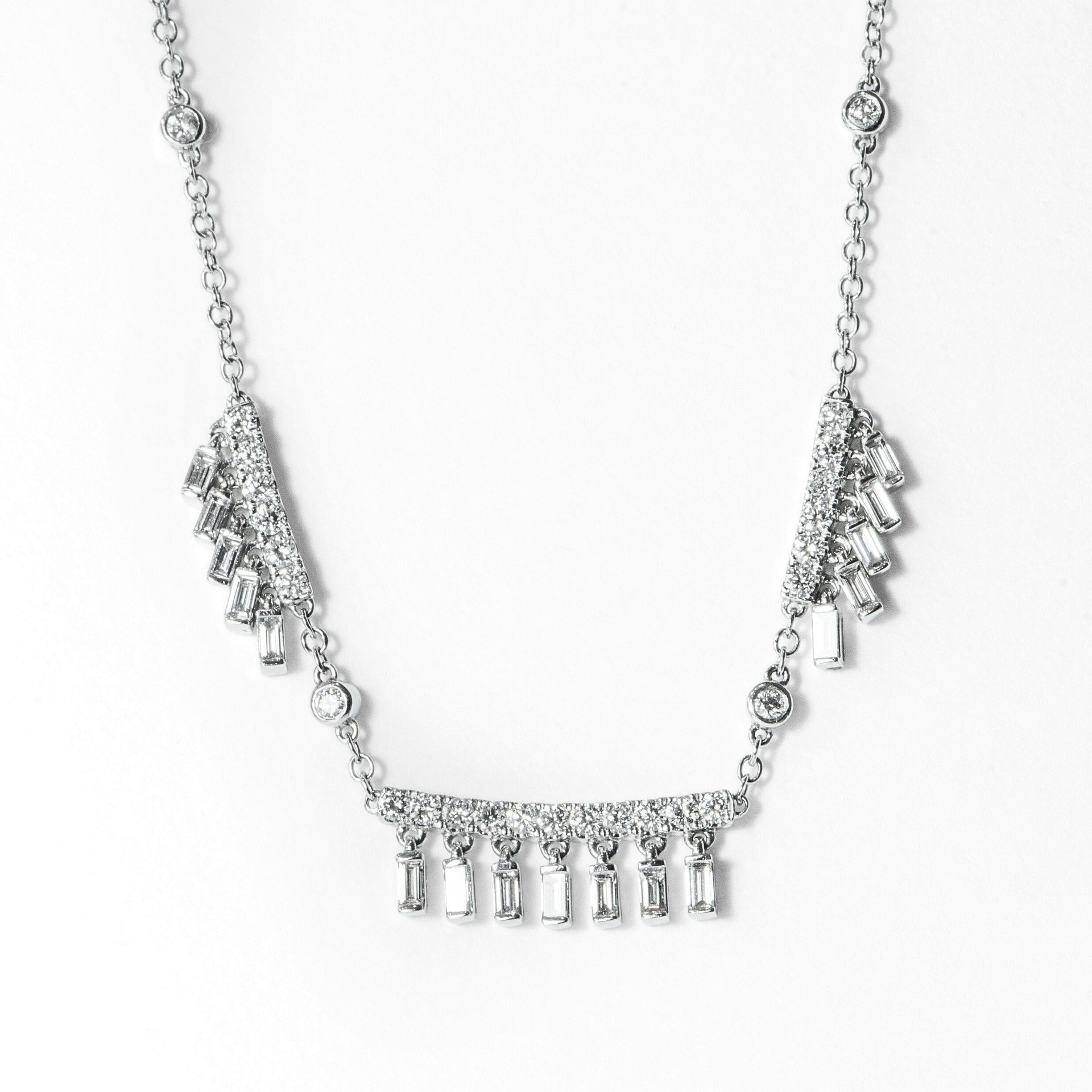 whimsical white gold necklace with round and baguette diamonds 