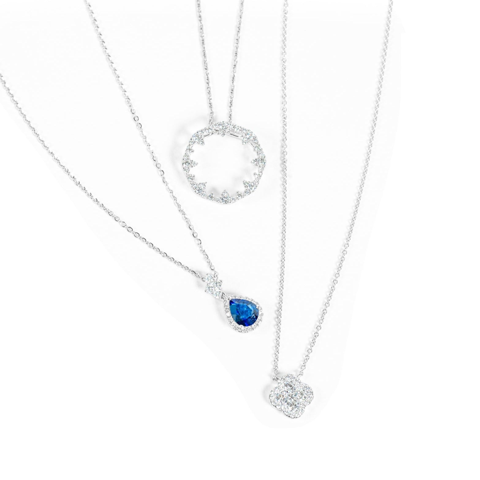 "Ciel" pear cut blue sapphire pendant and "Lumia" diamond circle pendant and "Fleur" Blanche Diamond Clover Necklace