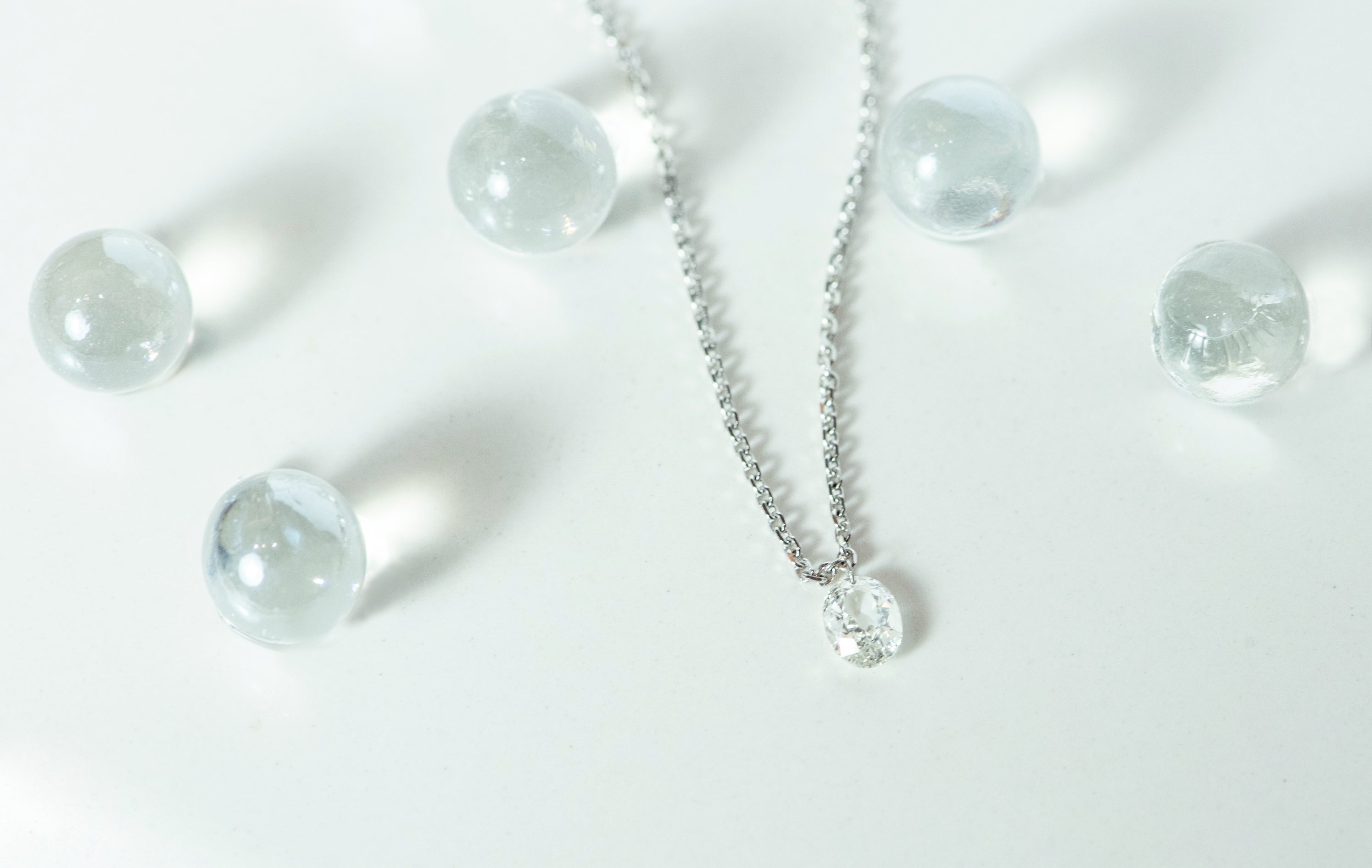 white gold and diamond necklace. floating diamond. laser drilled diamond. cable link chain. delicate necklace. dainty necklace. everyday necklace. april birthstone. SF jewelry, local jeweler, luxury, fine jewelry, bay area, handmade, gift for her, birthday gift, anniversary gift