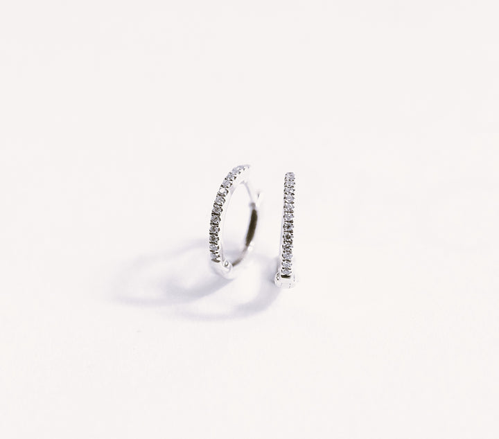18k white gold diamond hoop earring on a white background