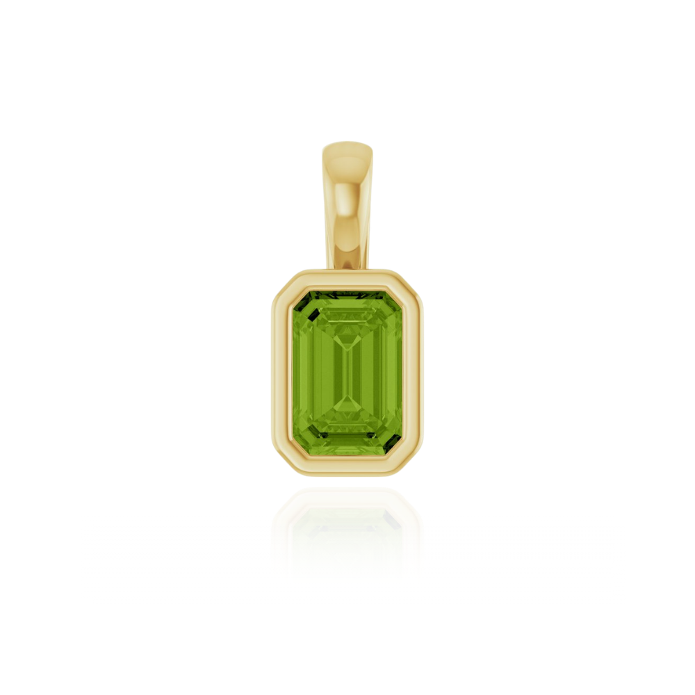 Gold pendant charm with a peridot gemstone on a white background