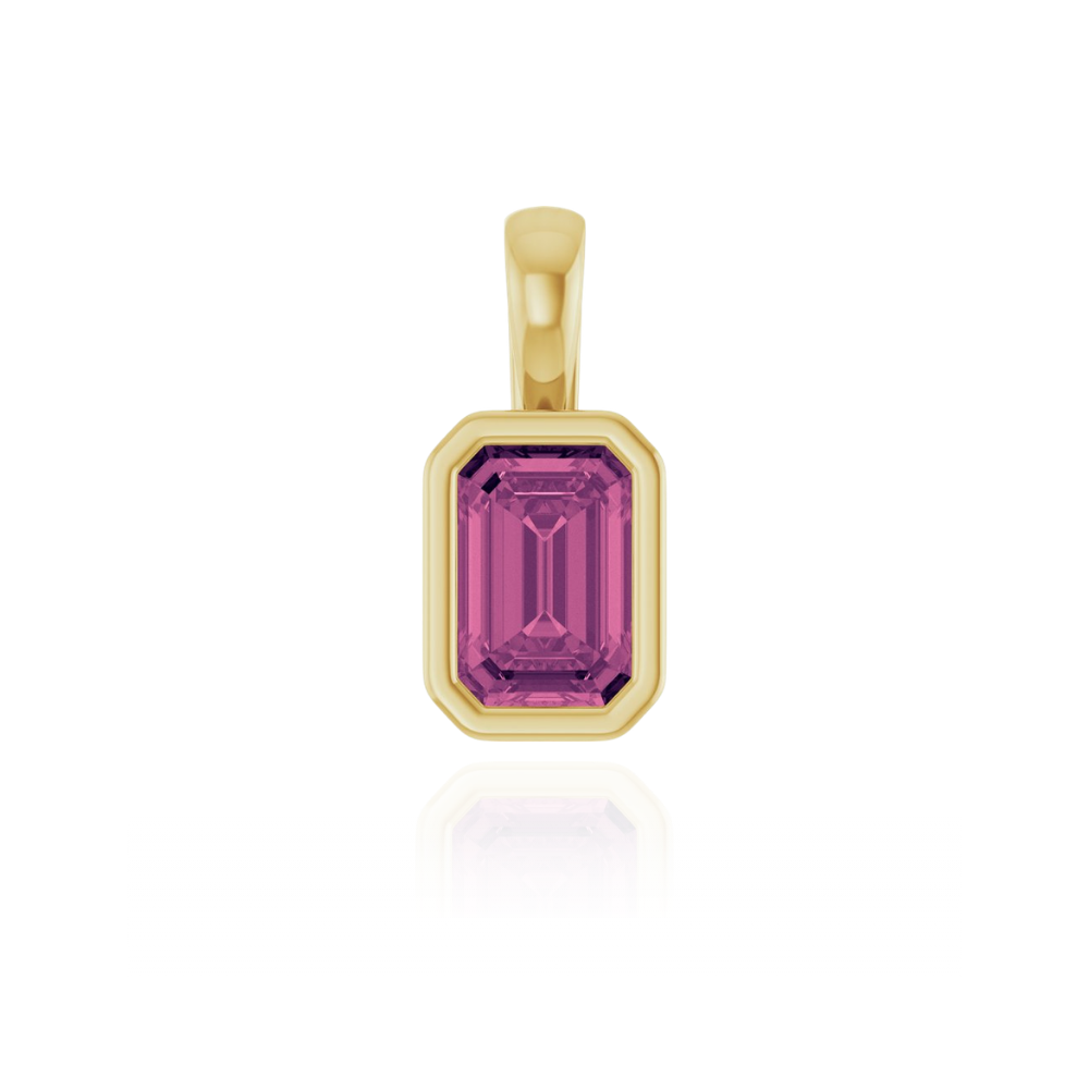 Gold pendant with a pink tourmaline gemstone on a white background