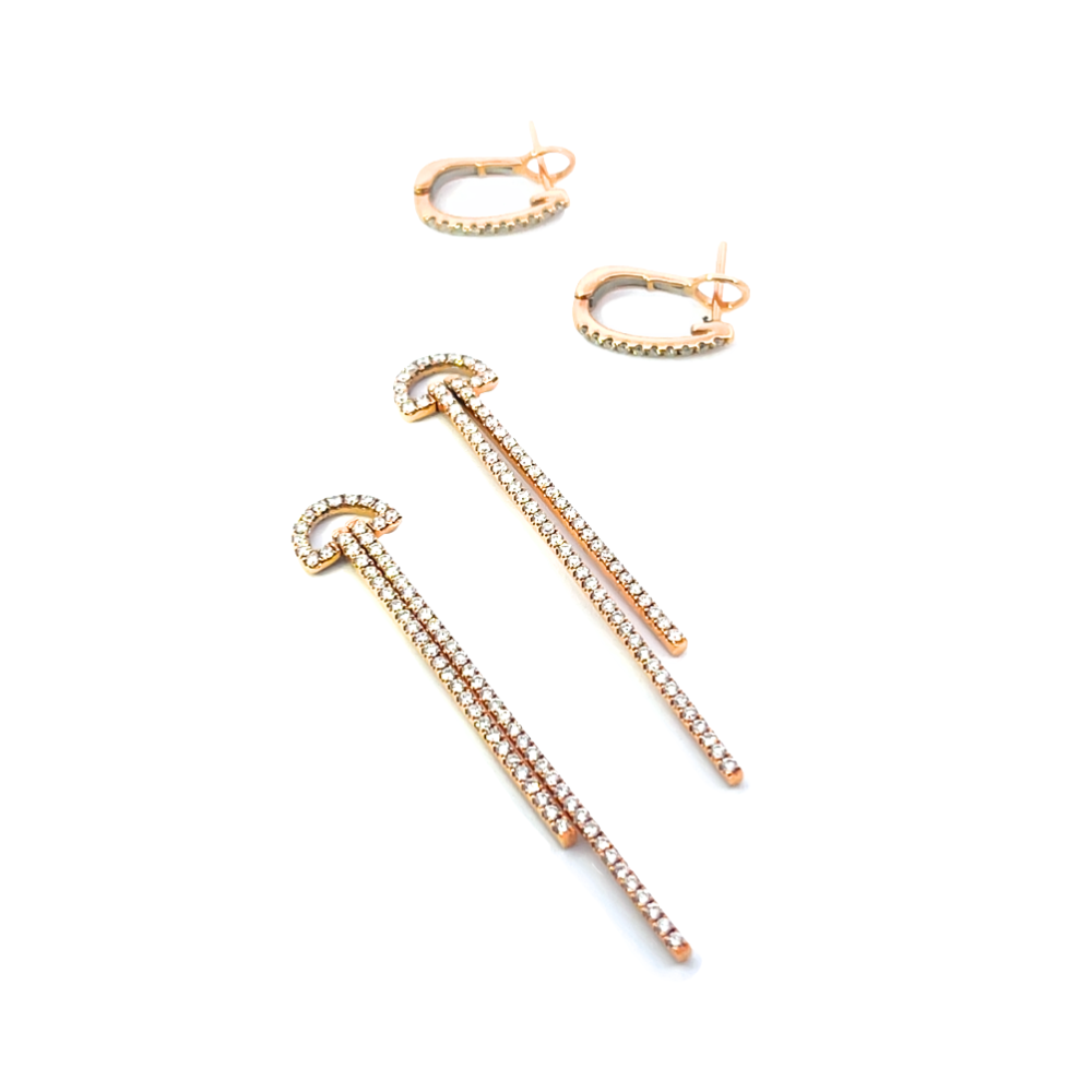 Rose gold earrings with diamonds on a white background