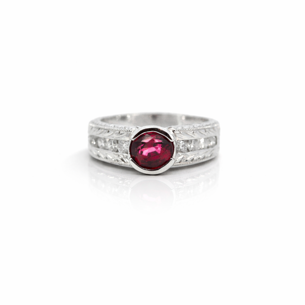 Platinum ring with a red spinel and diamonds on a white background