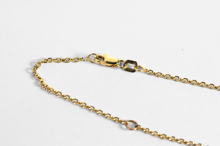 Lobster claw clasp in yellow gold. There are two jump rings to allow the necklace to be two different lengths as needed!