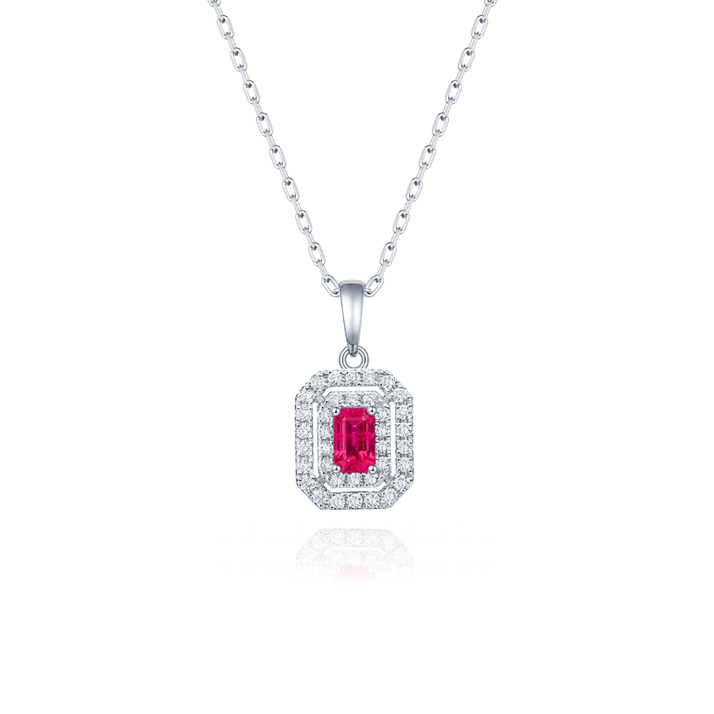 White gold pendant necklace with a red ruby and diamonds on a white background