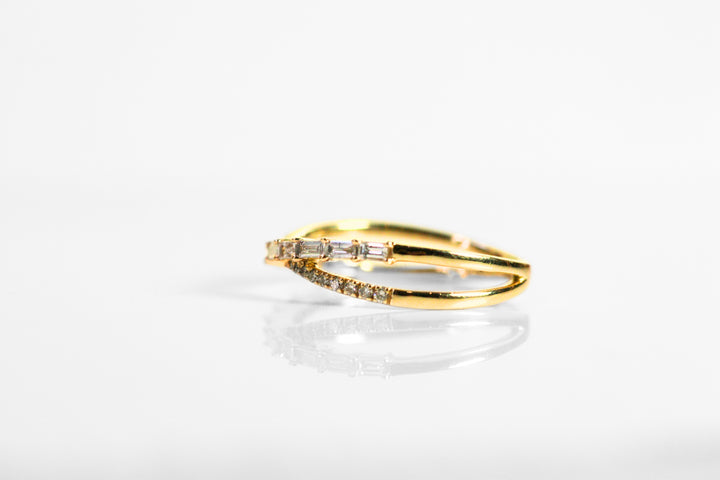 Side view of the ring. Diamonds stop once they get to the side of your finger and solid yellow gold continues to the back of the ring.