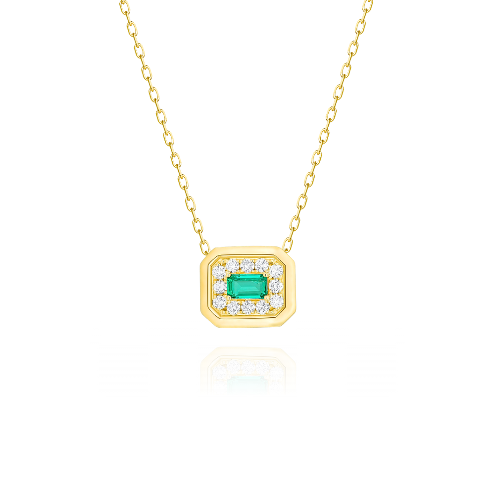 Gold necklace with emerald and diamonds on a white background