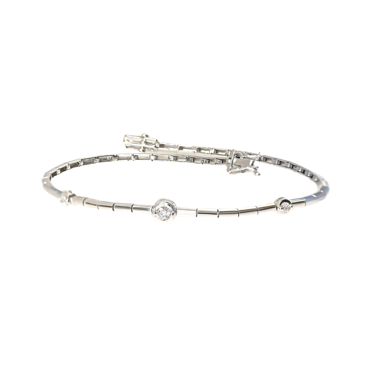 A silver-toned diamond bracelet featuring a central round-cut diamond framed with a bezel, with smaller round diamonds at the ends and a segmented chain design, shown on a plain white background.