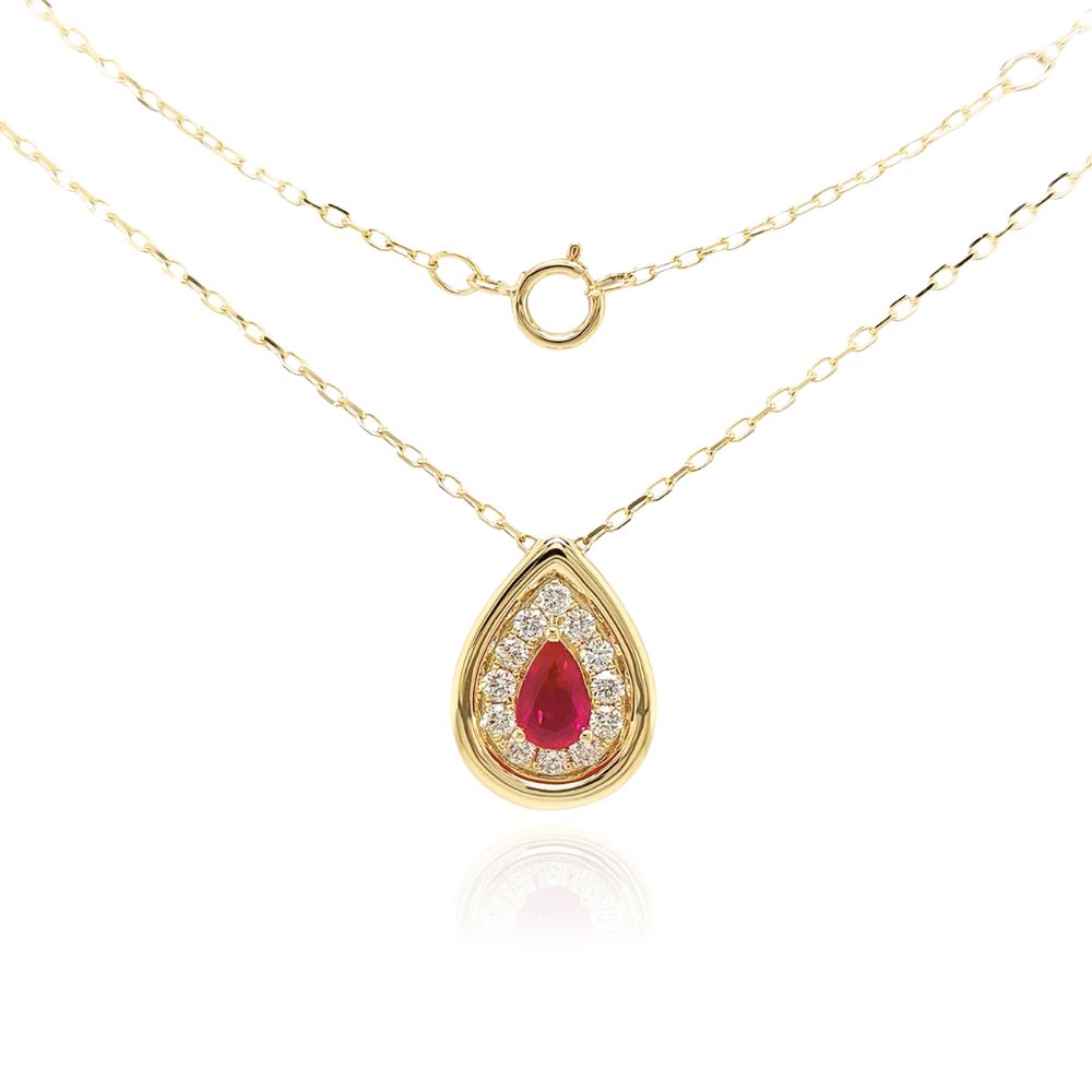 Gold necklace with a teardrop-shaped pendant featuring a red ruby on a white background