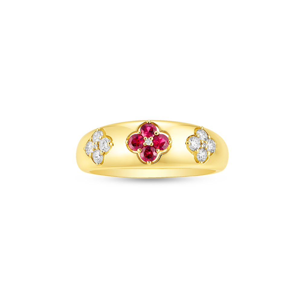 Gold ring with red ruby and diamond accents on a white background