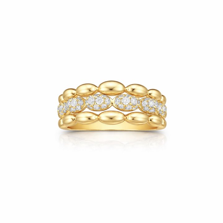 Gold ring with diamond accents on a white background